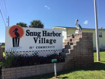 Snug Harbor Village Entrance